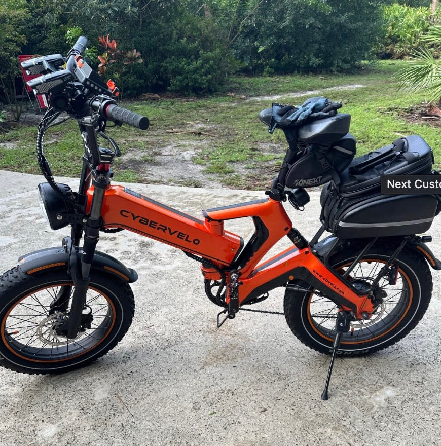 Folded e‑bike in the trunk of an SUV